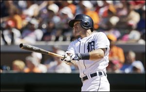 Detroit Tigers' Ian Kinsler watches his three-run home run during the fifth inning of a spring exhibition baseball game against the Toronto Blue Jays.