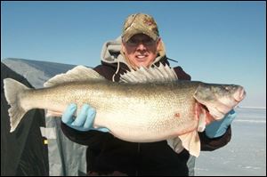 Rory Wineka of North Canton caught a 12-pound walleye through the ice on Lake Erie on Feb. 28. His top six fish weighed 59 pounds that day.