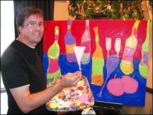 Artist Greg Justus works on a painting during the Starry Night Wine & Art Gala that will be included in the auction.