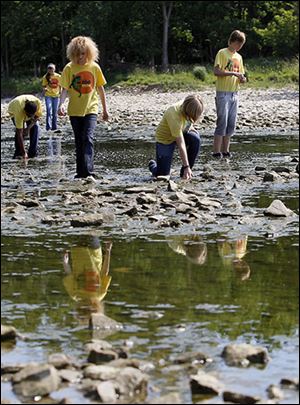 Volunteers from Toledo ZooTeens take part in last year’s river cleanup.