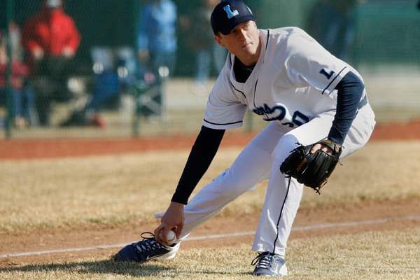 Lake-pitcher-Jayce-Vancena-picks-up-a-bunt-and-hurls-it-to-1st-base