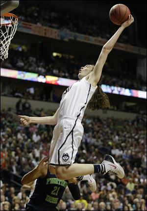 Connecticut forward Breanna Stewart (30) shoots against Notre Dame guard Kayla McBride (21) during the first half.