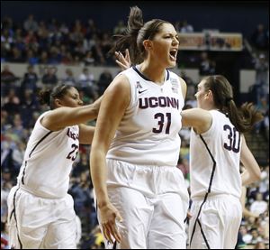 Connecticut center Stefanie Dolson (31) celebrates a basket against Notre Dame during the first half.