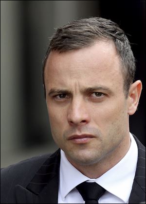 Oscar Pistorius arrives at the high court in Pretoria, South Africa, today.