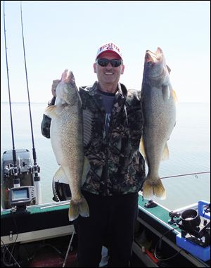 Bryan Johnson of Oregon caught two walleyes that weighed more than 12 pounds while fishing in roughly 25 feet of water off Catawba Point recently.