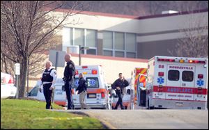 Officials outside of Franklin Regional High School. Five people were stabbed at the start of the school day Wednesday morning.