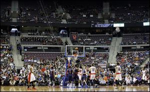 Empty seats are seen during the first half of a game Sunday between the Detroit Pistons and the Toronto Raptors in Auburn Hills, Mich.