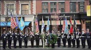 Honor Guard members line up in front of the Forum Restaurant in Copley Square, where a wreath laying ceremony was held to commemorate the one year anniversary of the bombings.