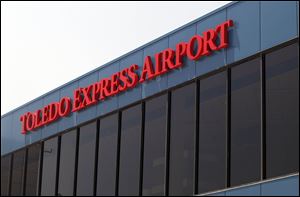 Despite a rise in passenger traffic at Toledo Express, the loss of a flight to Chicago has imperiled a $750,000 federal grant.