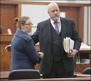 Lynne Smith and her attorney, Tom Stebbins, leave Ottawa County Municipal Court in Port Clinton. She is charged with vehicular homicide in the death of Emilee Gagnon of Holliston, Mass., who was struck and killed Sept. 23 on State Rt. 163 near Genoa while riding her bicycle.