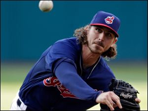 Cleveland Indians starting pitcher Josh Tomlin delivers against the Minnesota Twins in the first inning.