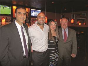 At the Toledo Bar Association's Take a Lawyer to Dinner are, from left: Said Orra, Bruce Gradkowski, Sanaa Orra and Judge Jack Puffenberger.