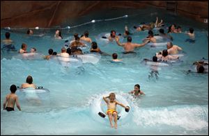 People enjoy the pool at the Kalahari indoor water park in Sandusky.