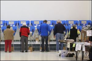 Voters cast their ballots at the Bulldog Center in Rossford.