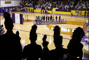 The Waite High School marching band prepares to play the alma mater during a rededication  ceremony of the school in the Grant Murray Field House.