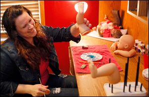 Jennifer Neal makes a baby doll in her home business called Reborn Nursery in Elmore. Ms. Neal’s dolls are sold on eBay to customers worldwide. Her highest sale, she said, was $1,800.