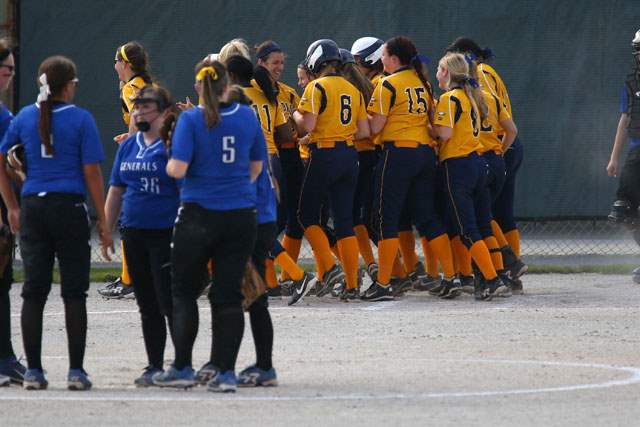 SPT-DistrictSoftball21pAnthony-Wayne-converges-on-the-mound-as-N