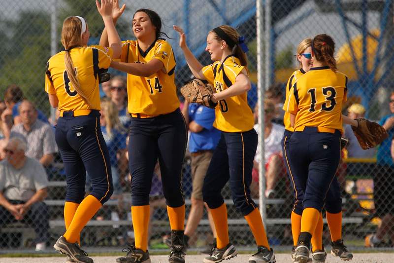 SPT-DistrictSoftball21pNotre-Dame-s-Nicole-Butson-left-high-fives