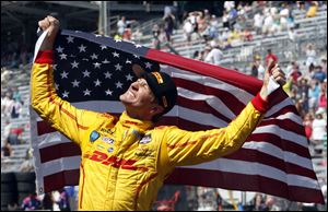 Ryan Hunter-Reay celebrates after winning the 98th running of the Indianapolis 500 IndyCar auto race at the Indianapolis Motor Speedway in Indianapolis.