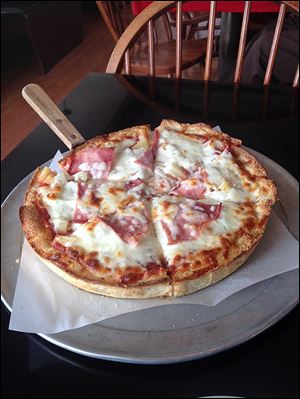 Campus Pollyeyes 'Hawaiian Punch' pizza with ham and pineapple.