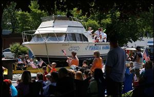 A Lost Peninsula Marina float passes by, a nod to the area’s proximity to the water.