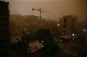 A view of Tehran, Iran, today while a flash dust storm hits the Iranian capital.