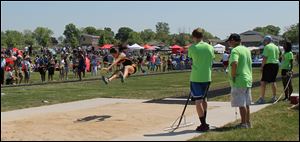 Miranda Johnson set a Division 4 state meet record by winning the long jump competition at 18 feet, 6½ inches. Johnson will compete next year at Siena Heights University.