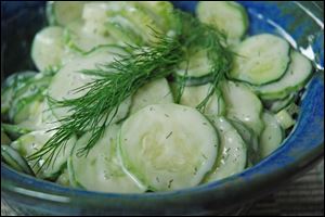 Creamy cucumber salad is a potluck favorite.