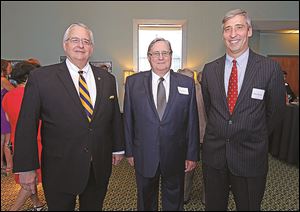 Joseph Zerbey, left, Dr. Lloyd Jacobs, center, and Dave Morlock, during the 50th anniversary celebration of the founding of the Medical College of Ohio at the University of Toledo Medical Center.