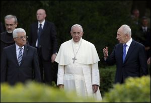 Pope Francis, Israel's President Shimon Peres, right, and Palestinian President Mahmoud Abbas, left, pray for peace today at the Vatican.