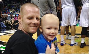 Joshua Chambers, a 4-year-old boy with leukemia, with his father, Jeremy, who grew up in Perrysburg.