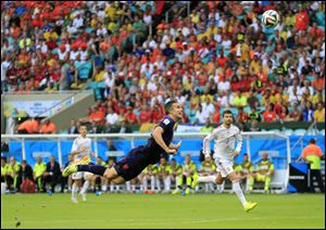 Netherlands' Robin van Persie scores a goal during the group B World Cup soccer match between Spain and the Netherlands today at the Arena Ponte Nova in Salvador, Brazil.