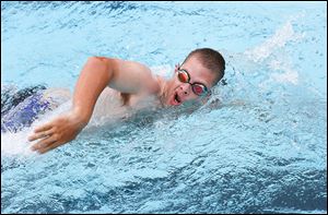  Jason Rupert, who will be a swimmer in the National Special Olympics, does laps at the City Park pool in Bowling Green.