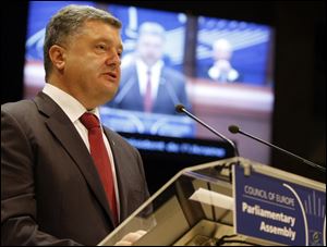 Ukrainian President Petro Poroshenko delivers his speech at the Parliamentary Assembly of theCouncil of Europe in Strasbourg, eastern France, today.