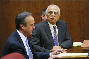 Dr. Nabil Ebraheim, 63, right, sits with his attorney Jerry Phillips during his bench trial before Judge Timothy Kuhlman in Toledo Municipal Court. Dr. Ebraheim was found guilty of vehicular manslaughter, a misdemeanor, for causing the death of motorcyclist Lawrence J. Hilton, 54, of Swanton in August.