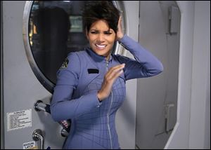 Halle Berry in a scene from the upcoming series ‘‍Extant.’ Berry  plays an astronaut who returns home from a yearlong solo mission only to discover that, while in flight, she was somehow impregnated.