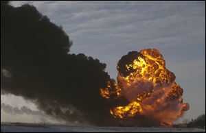 A fireball goes up at the site of an oil train derailment in Casselton, N.D., in December. 