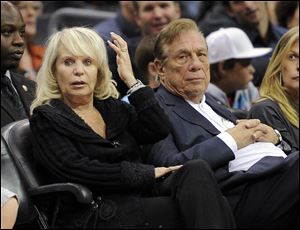 Shelly Sterling sits with her husband, Donald Sterling, during a Los Angeles Clippers' NBA basketball game in 2010.