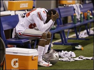 Ohio State's Corey Smith reacts on the bench near the end the Big Ten Conference championship NCAA college football game against Michigan State Saturday Dec. 7, 2013, in Indianapolis. Michigan State defeated Ohio State, 34-24.