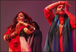 Anupama Mohanty, left, practices a dance number during a rehearsal for 