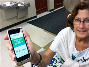 Nancy Crandell, Sylvania schools communication director, proudly displays the district's re-designed Web site that is mobile device friendly. The site, launched Aug. 1, is optimized to shrink down for any sized screen or mobile phone. 