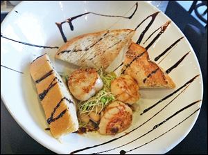 Melt Shoppe's seared scallops .