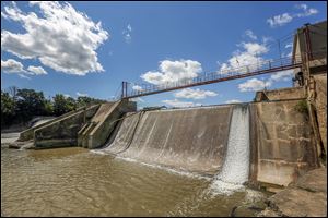 Water thunders over the Ballville Dam, one of the oldest and largest on the watershed. The sediment behind the dam is described by one activist as ‘‍silt on steroids’ and requires special care.