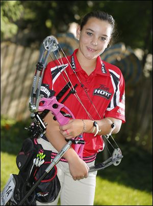 National champion archer Sophia Howard, 11, at her Sylvania home.