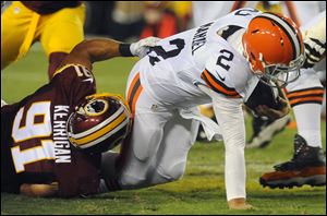 Washington Redskins outside linebacker Ryan Kerrigan (91) sacks Cleveland Browns quarterback Johnny Manziel (2) during the first half.