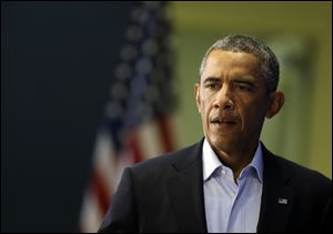 President Barack Obama approaches a podium in Edgartown, Mass., Wednesday, Aug. 20, 2014, to address members of the media about the killing of American journalist James Foley by militants with the Islamic State extremist group.