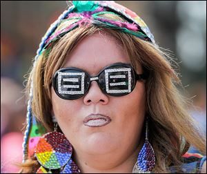 Haley Hugo sports custom-designed shades at the Toledo Pride event in the Warehouse District downtown.