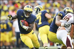 Michigan's De'Veon Smith will be counted on at running back. He gaine 117 yards in 26 carries in 2013.