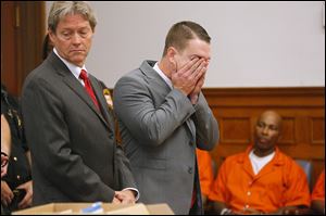 Brian Rosenburg, 22, right, with his attorney, George Gerken, stand before Lucas County Common Pleas Judge Gary Cook.