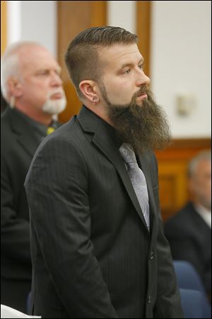 Robert Stanton, oldest son of Judith Crawford, 47, pauses while reading his victim impact statement during the sentencing.